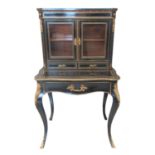 Victorian French design ebonised and gilded ladies two stage bonheur du jour, the shaped cornice