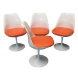 Set of six Saarinen Tulip swivel dining chairs, in white with orange seats standing on circular