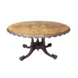 Victorian walnut inlaid Loo table, the oval top carved with foliate shaped boarder above a