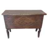 17th century style oak plank coffer of small proportions, the hinged and moulded lid above a front