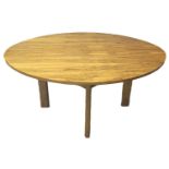 Mid century coromandel finish circular centre table, having two additional leafs and standing on