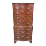 18th century style mahogany serpentine chest on chest, the moulded cornice above four drawers with