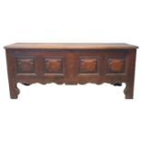 19th century continental oak coffer, the moulded top above four fielded panels with herring bone