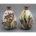 A pair of Victorian Doulton Burslem vases, hand-painted with irises, dated 1883, with painters