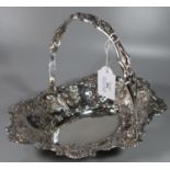 Late Victorian silver fruit basket with single swing handle having pierced borders and embossed