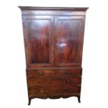 19th century mahogany two stage press cupboard, the moulded cornice above two blind panelled