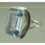 An aquamarine ring set in 18ct white gold. The large step cut aquamarine approx 18x 12mm. Ring