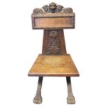 Victorian carved oak hall chair, the carved back with flower head and lion mask head decoration