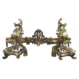 19th century French brass fire-dogs, in the style on Louis XIV decorated with stylised flowers and