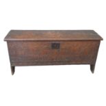 Early 18th century oak plank coffer, the moulded top carved and dated '1706' with initials 'I E'
