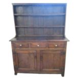 19th century West Country oak two stage dresser, the moulded cornice above boarded rack, two
