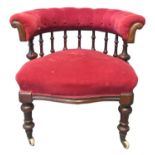 Late Victorian mahogany upholstered button and spindle back tub type bedroom chair, having