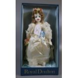 Royal Doulton porcelain doll in fitted clothing and original box. The box marked 'Royal Doulton