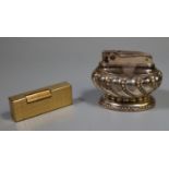 Ronson silver plated table lighter, together with a vintage Dunhill gold plated Rollagas lighter. (