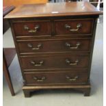 Reproduction mahogany straight front chest of two short and three long drawers on a projecting