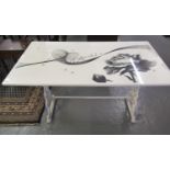 Victorian painted cast iron table base, with associate top with printed decoration of flowers and