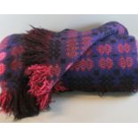 Two vintage woollen blankets; one a purple ground Welsh tapestry fringed edge blanket, the other a