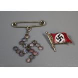 An enamelled German Second World War period Swastika pin brooch and another Swastika shaped