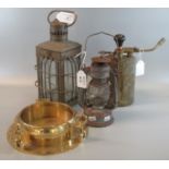 A brass square section hand lantern with protective bars, a brass pressure blow lamp and a small