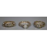 Three 9ct gold rings set with white stones. 6.3g approx. (B.P. 21% + VAT)