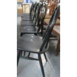 A set of six mid 20th century black ebonised finish beech and ash hoop and stick backed dining