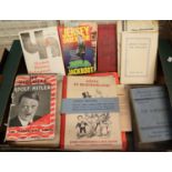 A box of German language and other World War II related books to include; 'Adolf in Blunderland', '