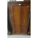 Early 20th Century mahogany single door free standing cupboard, the interior revealing a bank of six