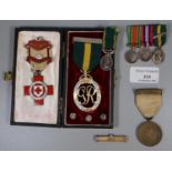 A George VI Territorial medal dated 1951, a group of three dress miniatures to include; the same