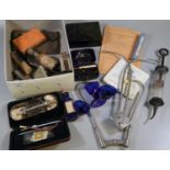 Box comprising medical equipment and similar items: syringes, glass bottles, Bristol blue eye