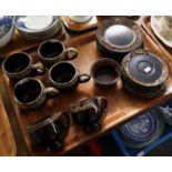 Tray of art pottery dark brown glazed teaware and a tray of Colclough floral teaware: teacups and