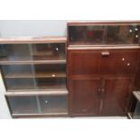 Mid Century Minty mahogany three sectional bookcase with glass sliding doors, together with