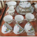 Wetley china English teaware with fruit design to include; teacups and saucers, various plates, milk