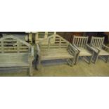 Collection of teak garden furniture to include two Lutyens style benches, pair of armchairs and