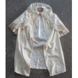 Victorian or Edwardian cream woollen cape with appliqued paisley designs and broderie anglaise trim.