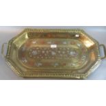 19th/20th Century Indian brass rectangular two handled tray with canted corners, overall decorated