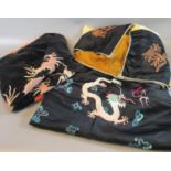 Two oriental probably Chinese velvet and embroidered cushion covers with dragon chasing flaming