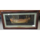 HMS Victory, a reproduction half block model study in glass case, framed. (B.P. 21% + VAT)