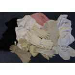 Box containing various antique fashion accessories to include; suede gloves, cotton bonnets, knitted