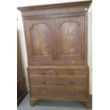19th Century Welsh oak press cupboard, with moulded cornice above two blind panelled doors,