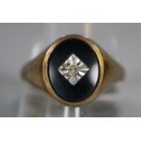 9ct gold onyx and diamond signet ring. 4.4g approx. Size V. (B.P. 21% + VAT)