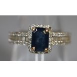 Art Deco design 9ct gold sapphire and diamond engagement ring. 2.6g approx, size N. Boxed. (B.P. 21%