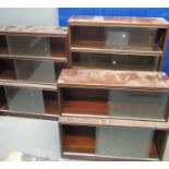 Two similar mid Century Minty mahogany three sectional bookcases with glass sliding doors,