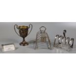 Barton silver miniature two handled trophy cup, together with a silver four section toast rack and