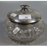 Heavy deeply cut crystal glass baluster shaped lidded bowl, the cover in engine turned silver with