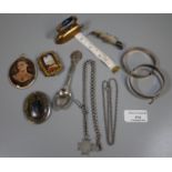 Collection of assorted metalware items; brass flat iron shaped tape measure, pin brooches, porcelain