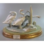 Lladro Spanish porcelain figure group of three geese on reeds and naturalistic and wooden gilded