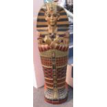 Modern novelty wooden single door cabinet in the form of an Egyptian Sarcophagus Pharaoh mummy.