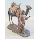 Bronzed composition study of an Arab man leading his camel, on a naturalistic base. Modern. 21cm