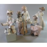 Five Nao Spanish porcelain figurines of young children together with a Nao porcelain figure group of