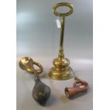 Large brass half baluster shaped doorstop with loop handle, together with a brass bulb horn and a